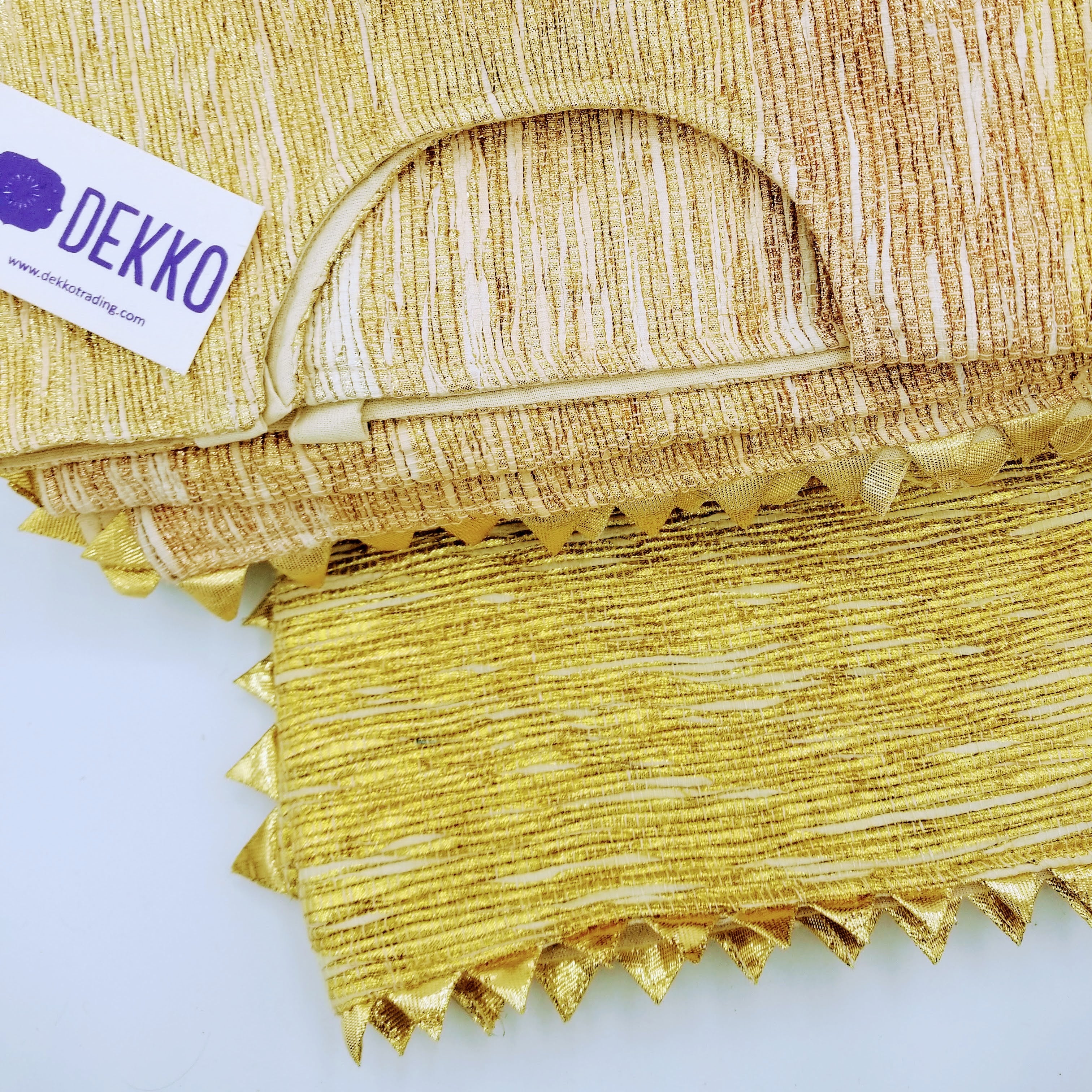 Square tree skirt made from upcycled golden-brown vintage saree fabric with woven texture and zigzag pinking shear edges, featuring a center opening with beige ribbon ties for closure, photographed against a white background