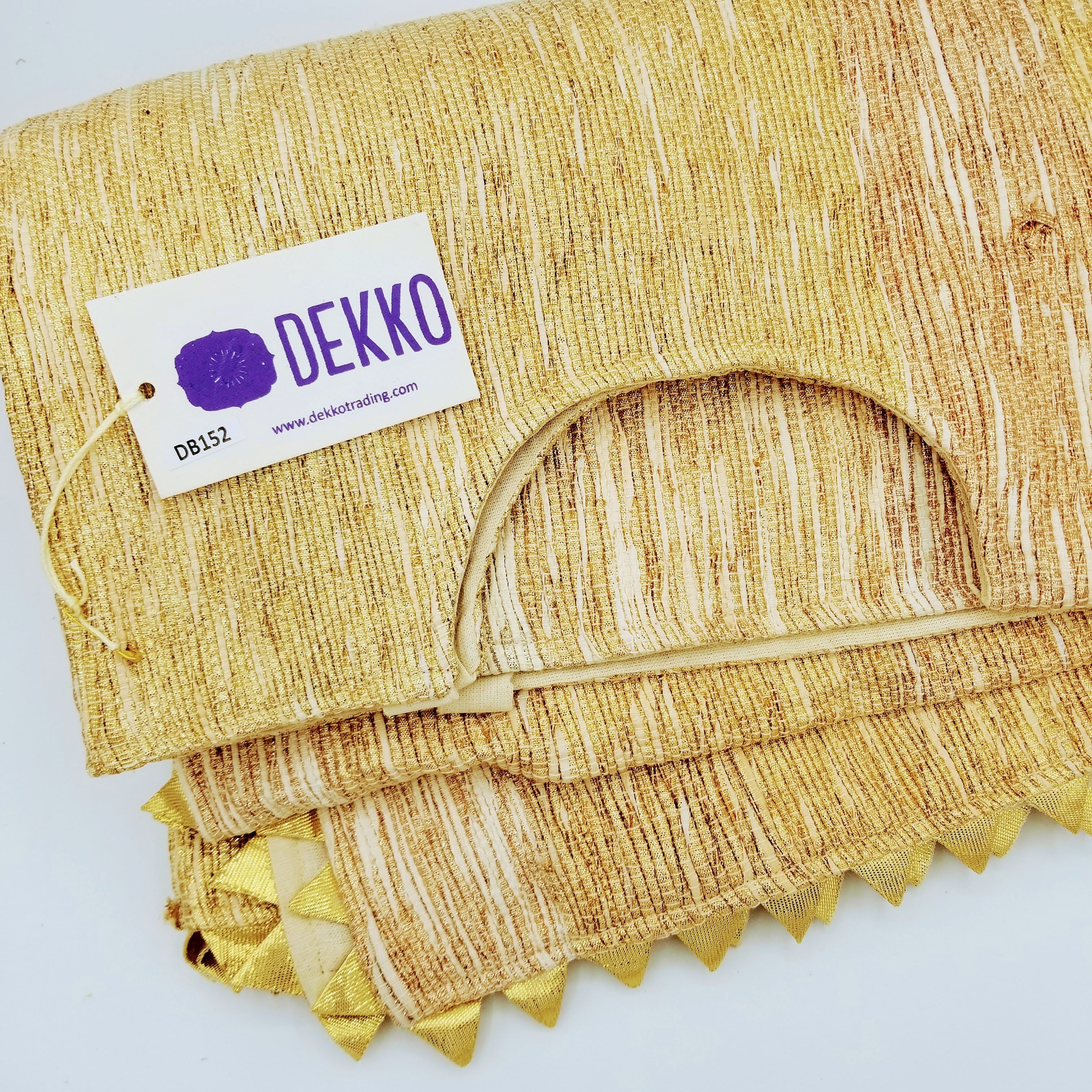 Square tree skirt made from upcycled golden-brown vintage saree fabric with woven texture and zigzag pinking shear edges, featuring a center opening with beige ribbon ties for closure, photographed against a white background