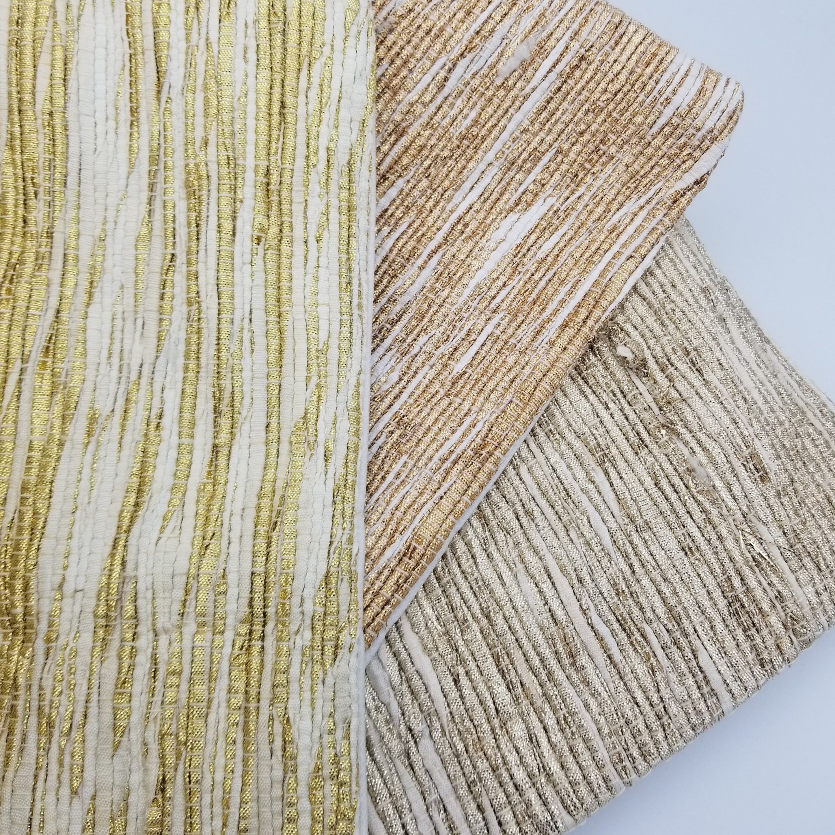 Circular tree skirt made from upcycled golden-brown vintage saree fabric with intricate woven texture and decorative border trim, featuring a center opening with white ribbon ties, photographed on a neutral background