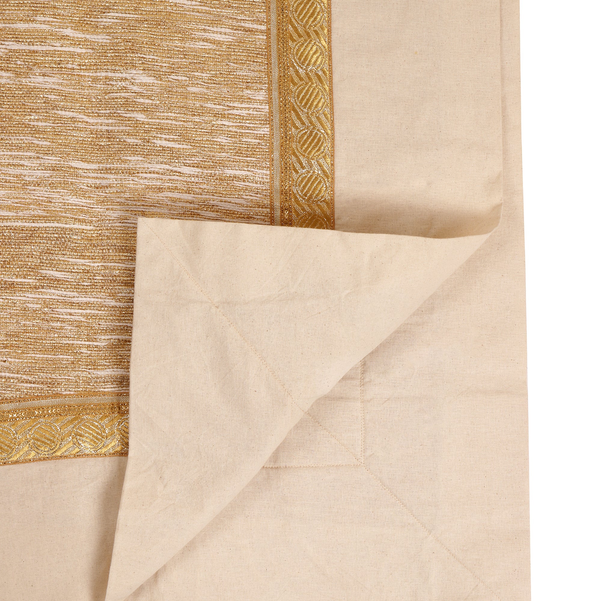 Circular tree skirt made from upcycled golden-brown vintage saree fabric with intricate woven texture and decorative border trim, featuring a center opening with white ribbon ties, photographed on a neutral background