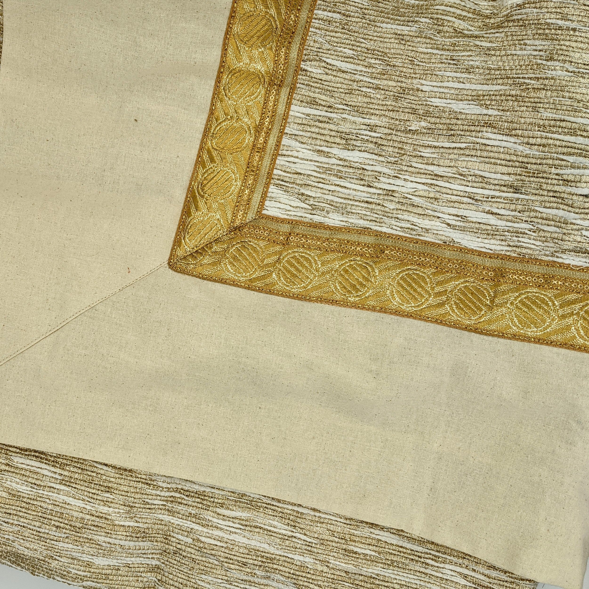 Circular tree skirt made from upcycled golden-brown vintage saree fabric with intricate woven texture and decorative border trim, featuring a center opening with white ribbon ties, photographed on a neutral background