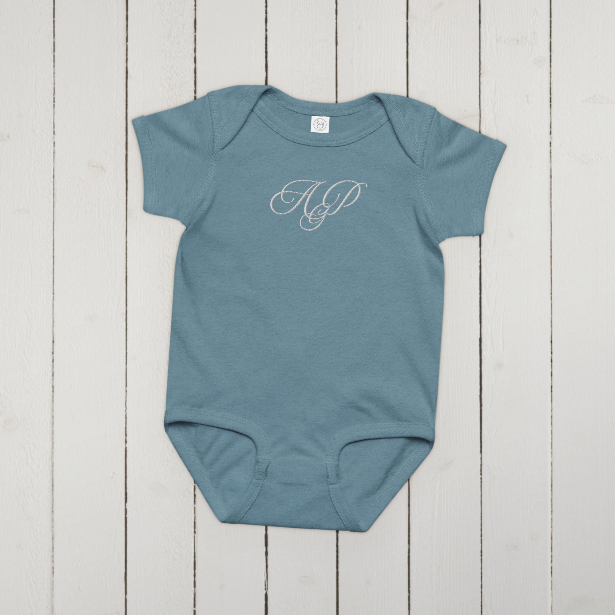 Elegant embroidered monogram Baby jersey bodysuit