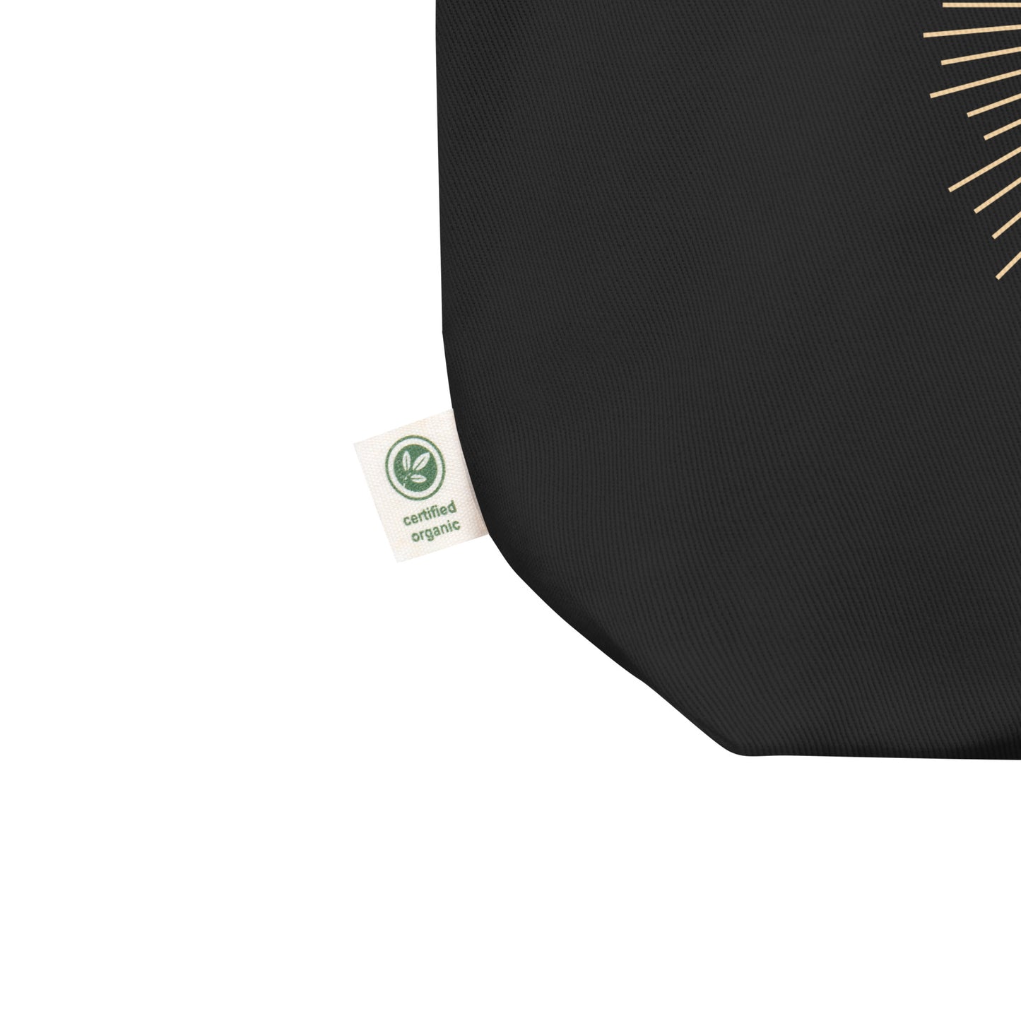 A zoomed in photo of the tote bag's tag that indicates the product is made with certified organic cotton.