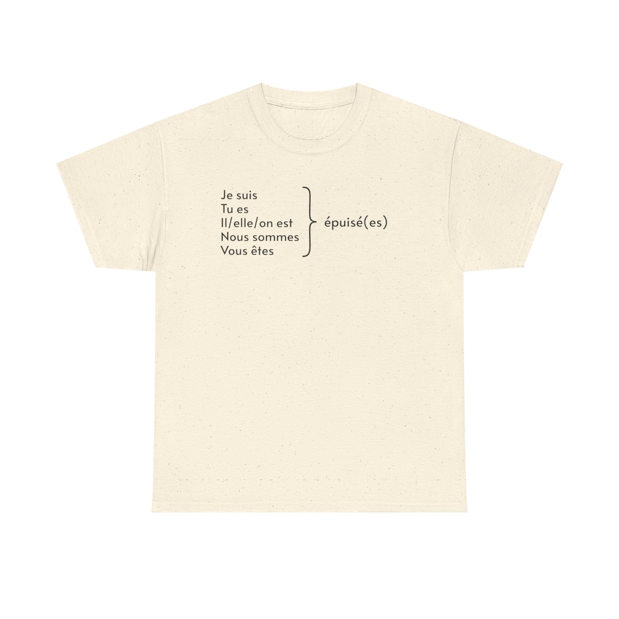 Ivory t-shirt featuring black French text displaying verb conjugations with "Je suis, Tu es, Il/elle/on est, Nous sommes, Vous êtes" followed by "épuisé(es)" (exhausted) with a bracket indicating all forms lead to being tired, photographed against a white background