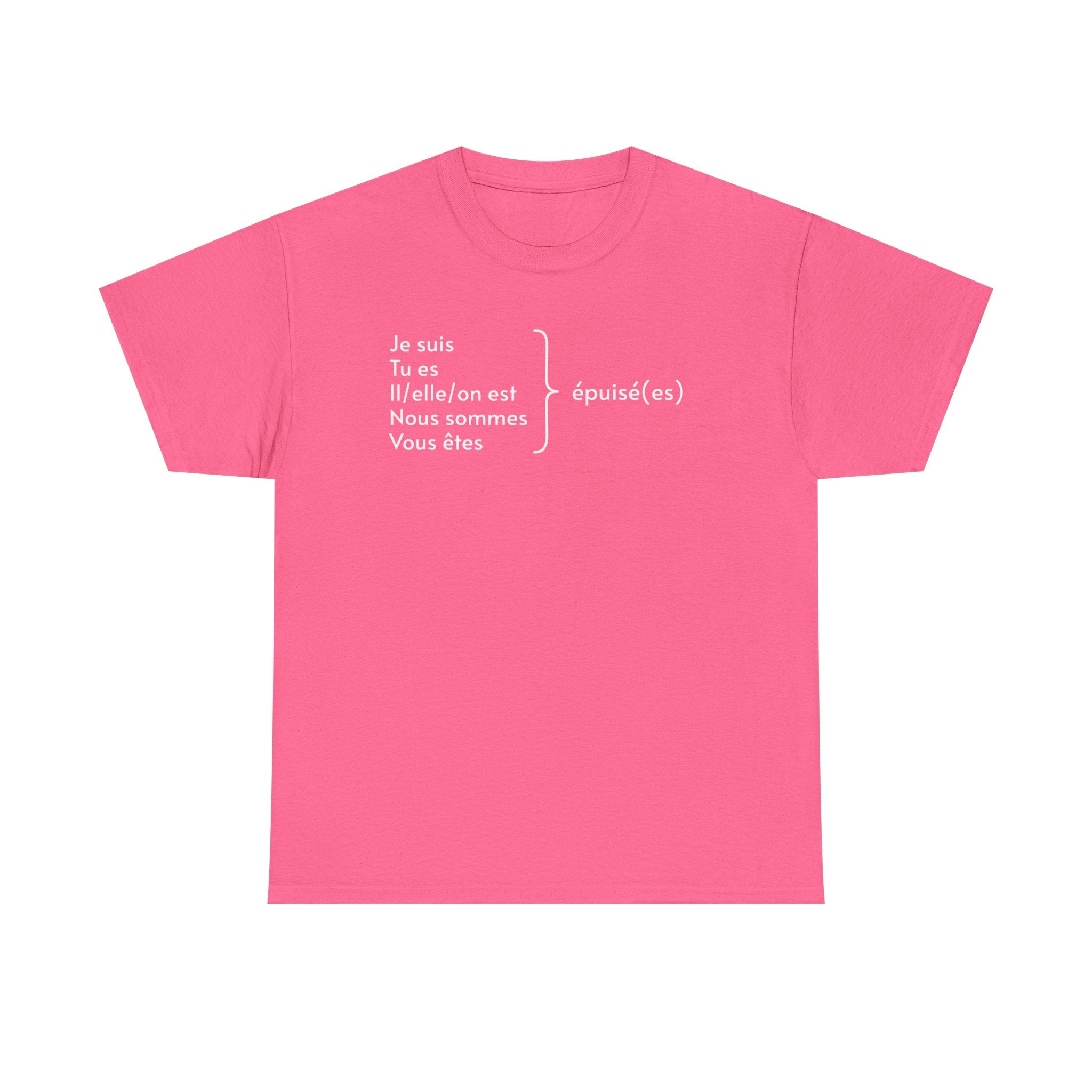 Hot pink t-shirt featuring white French text displaying verb conjugations with "Je suis, Tu es, Il/elle/on est, Nous sommes, Vous êtes" followed by "épuisé(es)" (exhausted) with a bracket indicating all forms lead to being tired, photographed against a white background