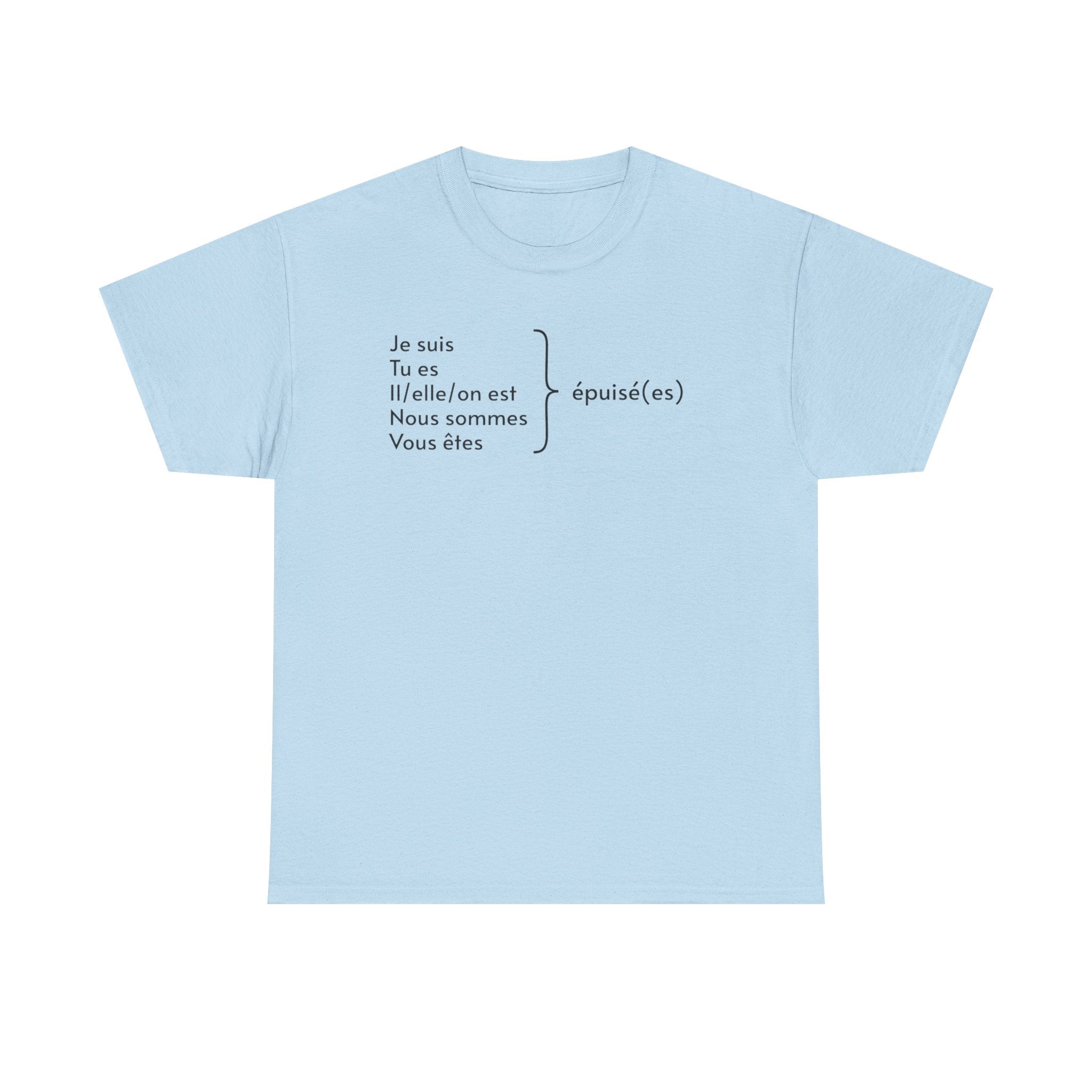 Light blue t-shirt featuring black French text displaying verb conjugations with "Je suis, Tu es, Il/elle/on est, Nous sommes, Vous êtes" followed by "épuisé(es)" (exhausted) with a bracket indicating all forms lead to being tired, photographed against a white background
