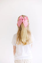 Pink Solid Oversized Bow by Evie Pearl Handmade