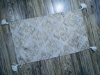 Tufted accent rug with corner tussels (25"x45")