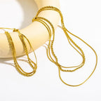 Triple Layered Necklace by Curated By Suarez