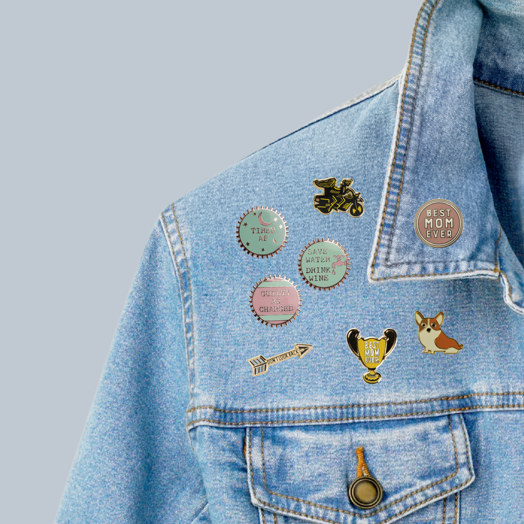 Don't Look Back Arrow Enamel Pin in Gold on Gift Card