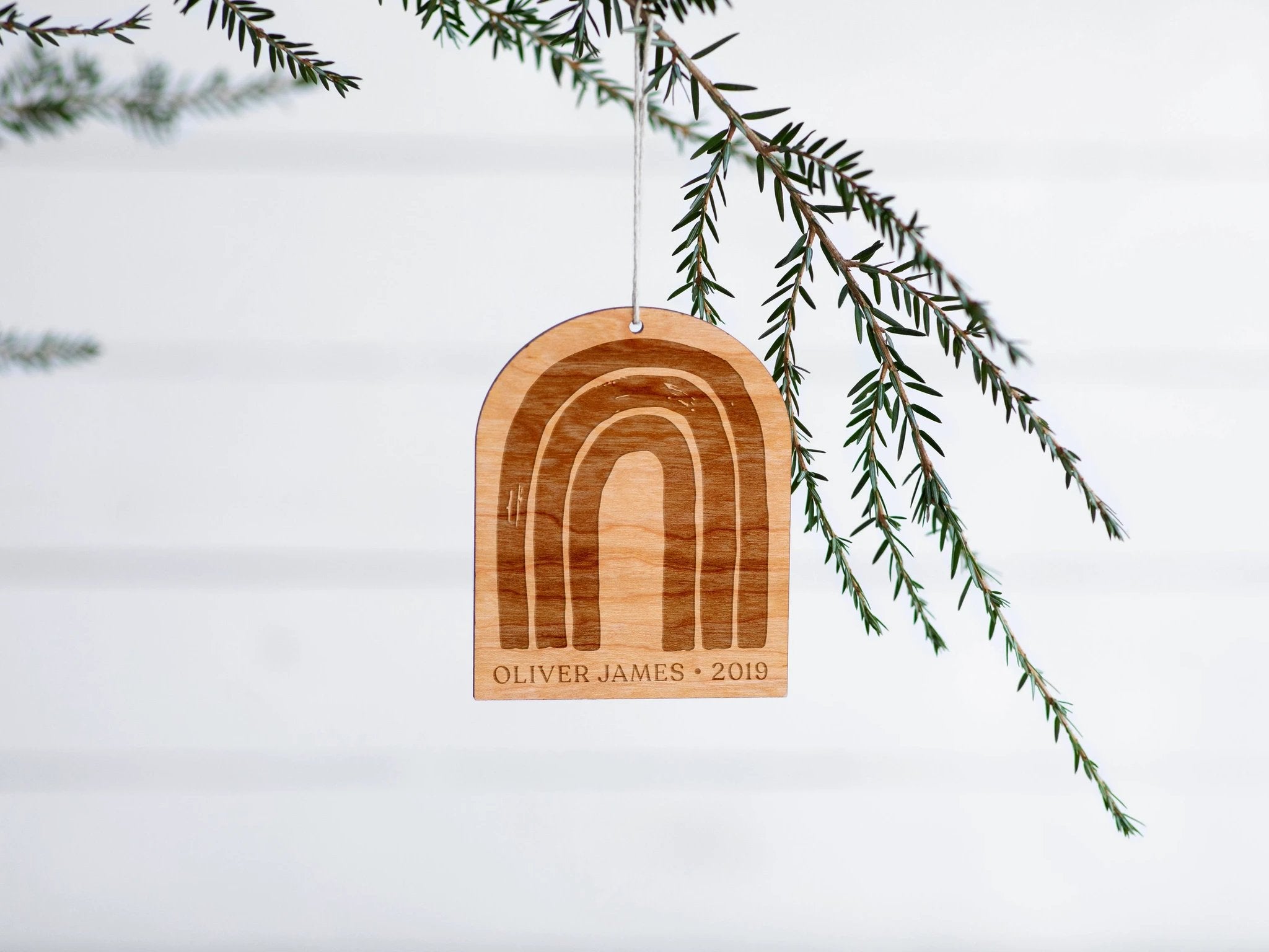 Personalized Wooden Rainbow Christmas Ornament by Gladfolk