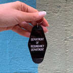 Department of Redundancy Department Motel Style Keychain in Black by The Bullish Store