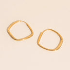 Titanium Hammered Oblong Huggie Hoop Earrings by Oh Clementine