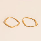 Titanium Hammered Oblong Huggie Hoop Earrings by Oh Clementine