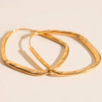Titanium Hammered Oblong Huggie Hoop Earrings by Oh Clementine