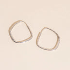 Titanium Hammered Oblong Huggie Hoop Earrings by Oh Clementine