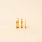 Smooth Tiny Huggie Hoop Earrings by Oh Clementine