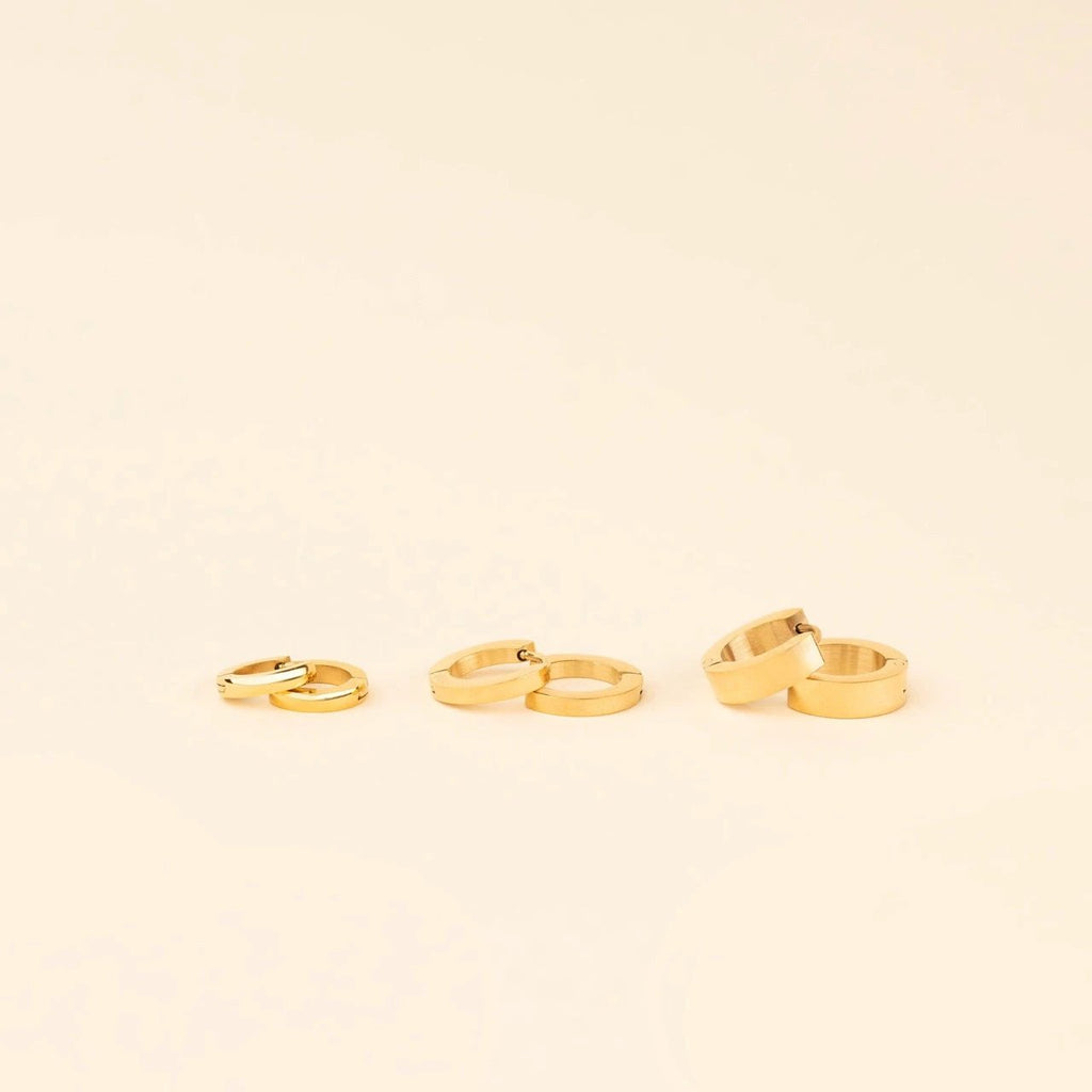 Smooth Tiny Huggie Hoop Earrings by Oh Clementine