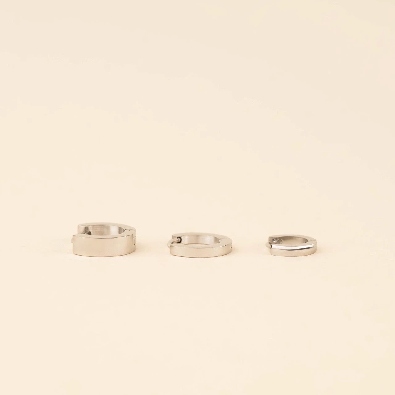 Smooth Tiny Huggie Hoop Earrings by Oh Clementine