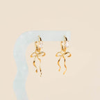 Dainty Bow Huggie Hoop Charms by Oh Clementine