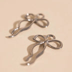 Dainty Bow Huggie Hoop Charms by Oh Clementine