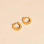 Smooth Tiny Huggie Hoop Earrings by Oh Clementine