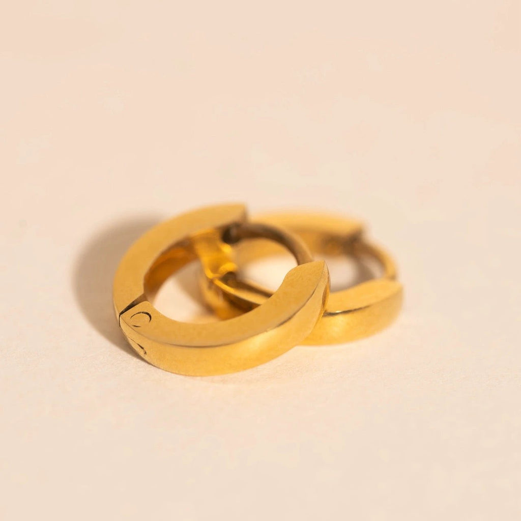 Smooth Tiny Huggie Hoop Earrings by Oh Clementine