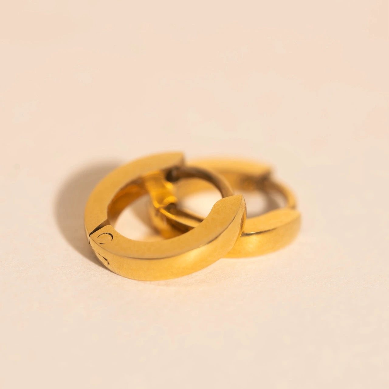 Smooth Tiny Huggie Hoop Earrings by Oh Clementine
