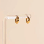 Smooth Tiny Huggie Hoop Earrings by Oh Clementine