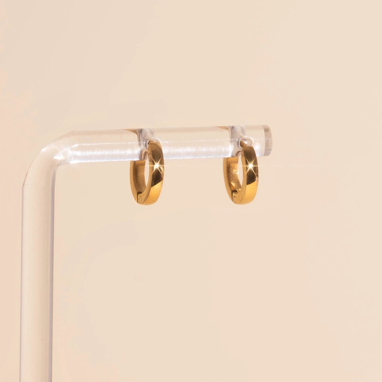 Smooth Tiny Huggie Hoop Earrings by Oh Clementine