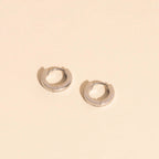 Smooth Tiny Huggie Hoop Earrings by Oh Clementine