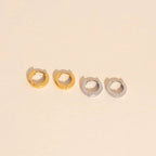 Smooth Tiny Huggie Hoop Earrings by Oh Clementine