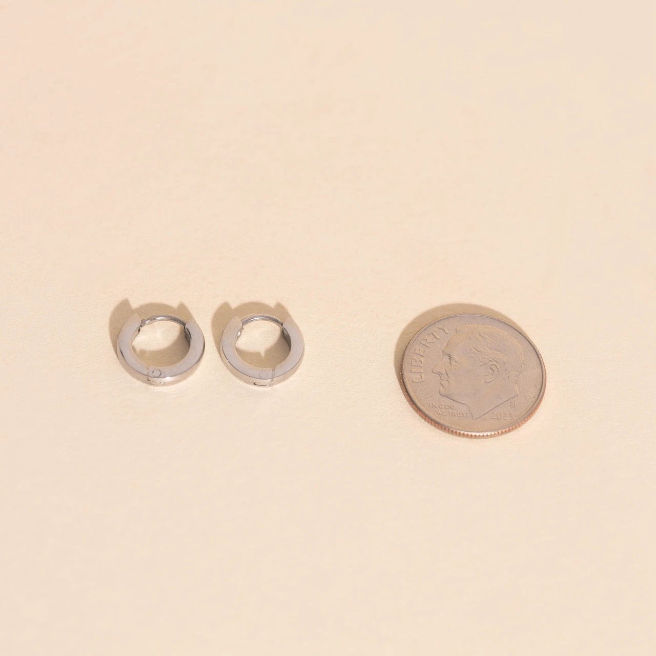 Smooth Tiny Huggie Hoop Earrings by Oh Clementine