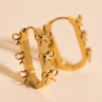 Stacked Rope Bow Oblong 3D Huggie Hoop Earrings by Oh Clementine