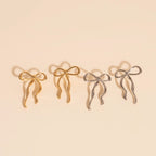 Jumbo Bow Stud Earrings by Oh Clementine