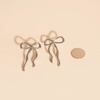 Jumbo Bow Stud Earrings by Oh Clementine