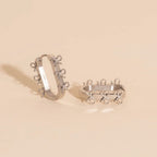 Stacked Rope Bow Oblong 3D Huggie Hoop Earrings by Oh Clementine