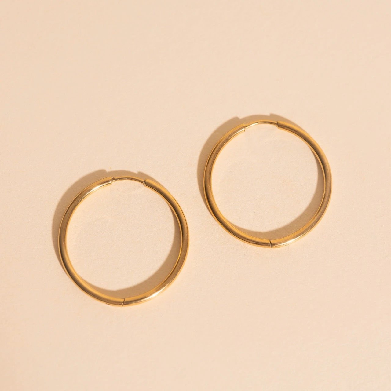 Circle Rounded Huggie Hoop Earrings by Oh Clementine