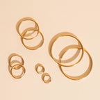 Circle Rounded Huggie Hoop Earrings by Oh Clementine