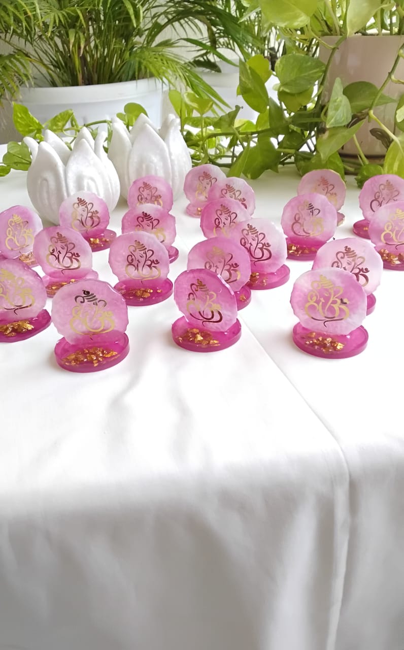 Combo of Akhand Diya, Resin Ganesha, Lotus Hanging in Organza Bag