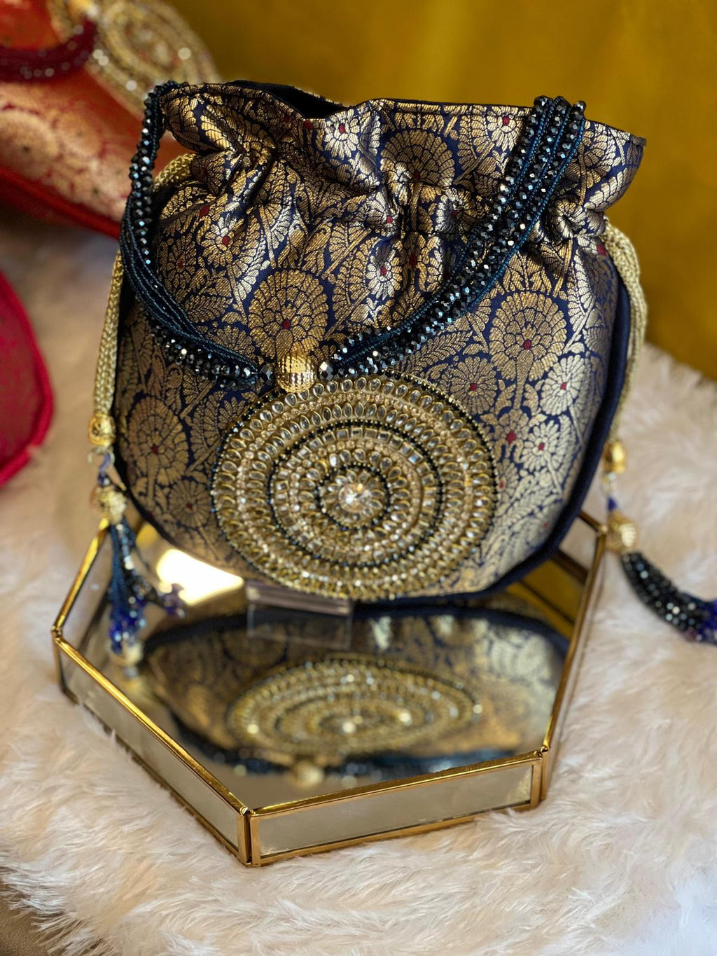 Rich Brocade Zari Potli Bag with Circular Motif With Stone