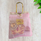 Combo of Akhand Diya, Resin Ganesha, Lotus Hanging in Organza Bag
