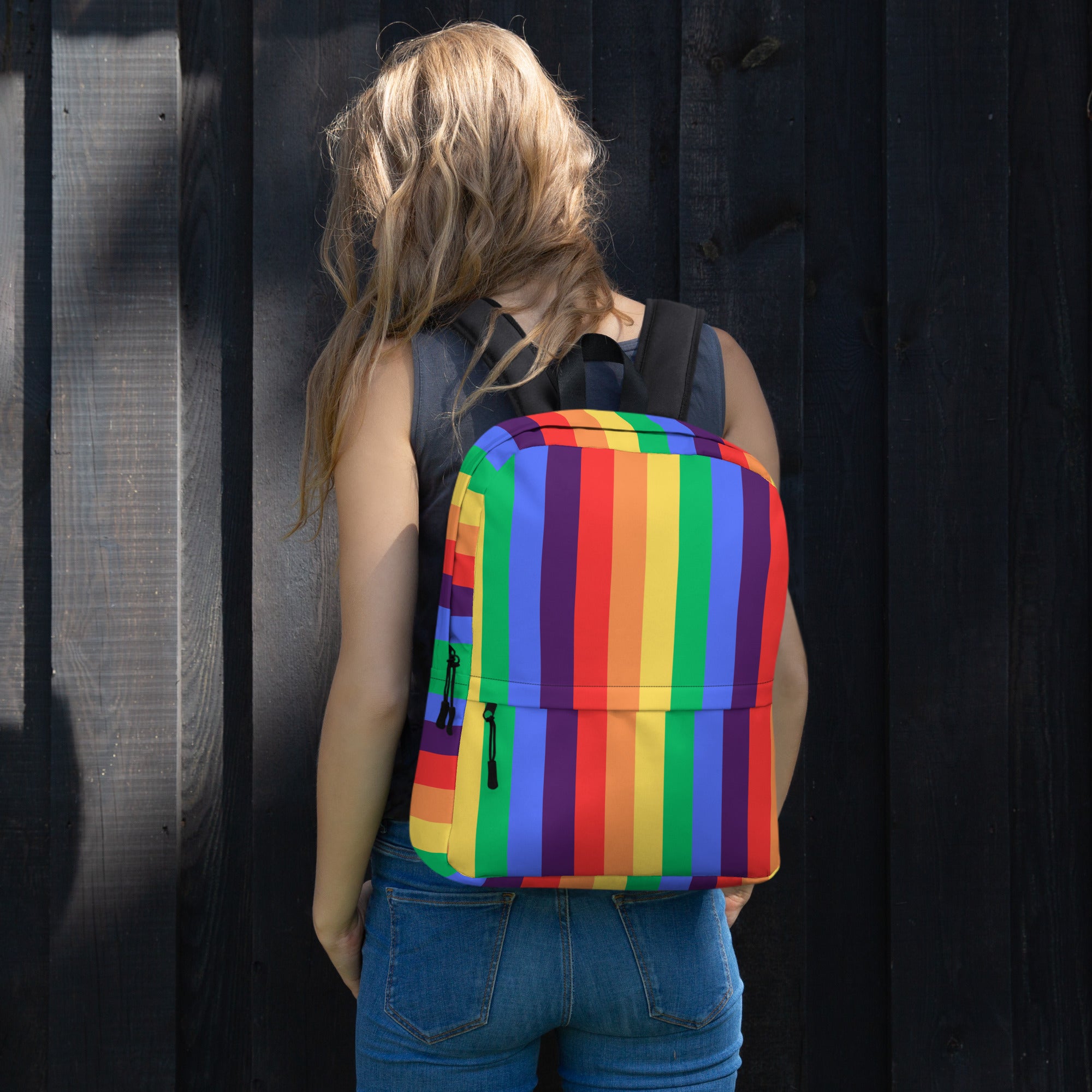 A polyester Rainbow striped Backpack with a front pocket