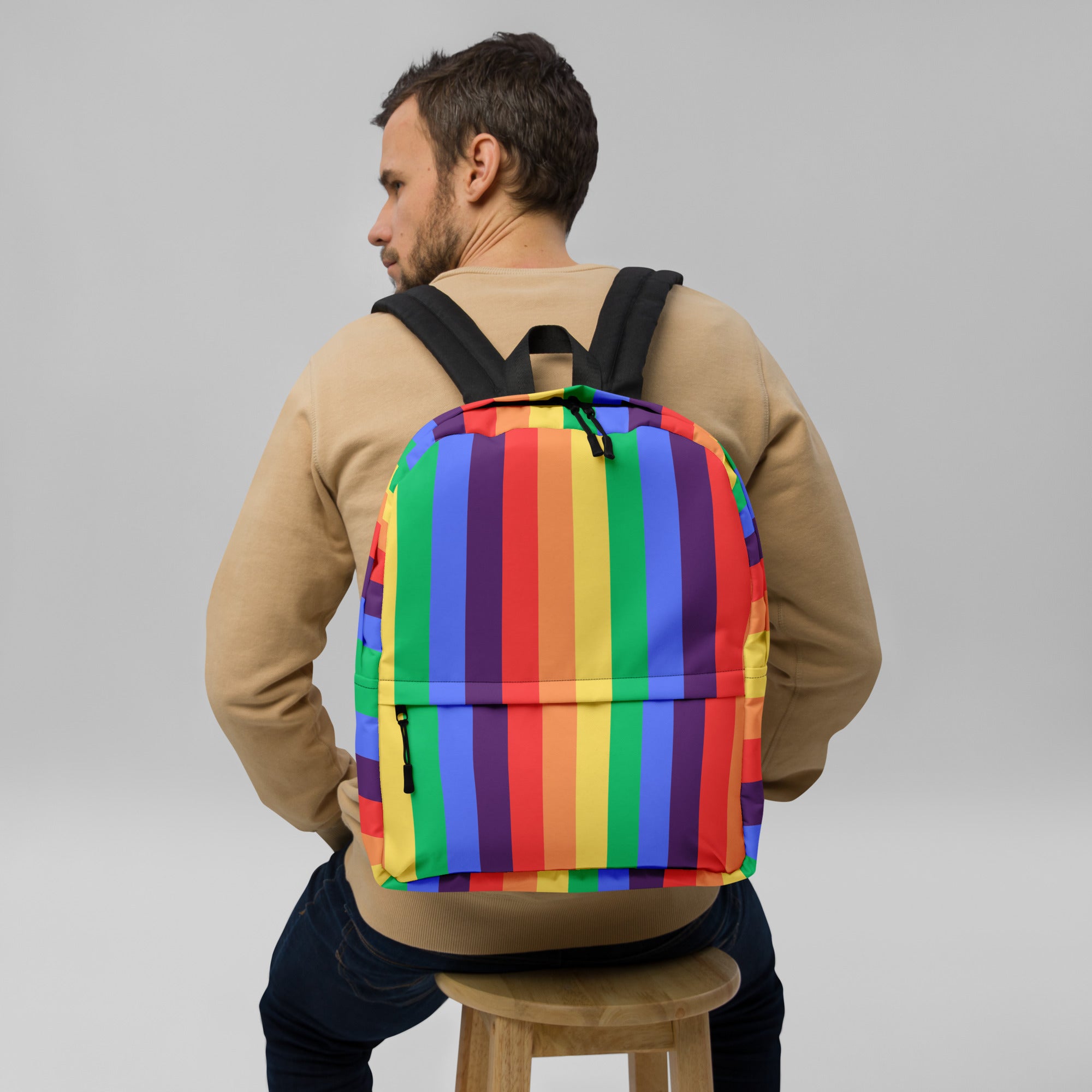 A polyester Rainbow striped Backpack with a front pocket