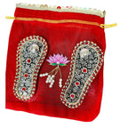 Antique Finish German Silver Laxmi Charan Paduka with Stone Work in Matching Potli La Vie Bien Antique Finish German Silver Laxmi Charan Paduka with Stone Work in Matching Potli
