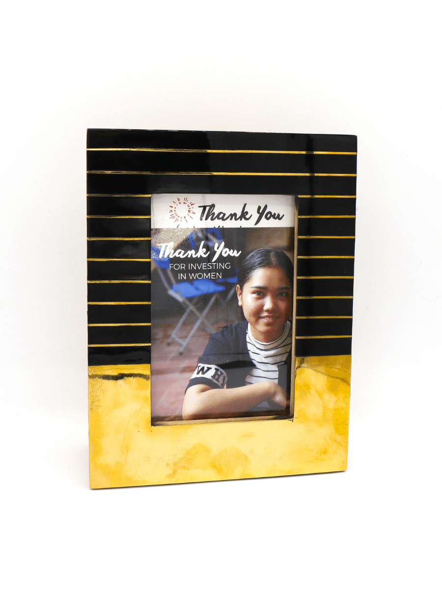 Black and yellow photo frame with a portrait of a woman inside on a white background