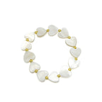 Be Mine mother of pearl heart and gold bead stretch bracelet by Alegria Accessories Inc