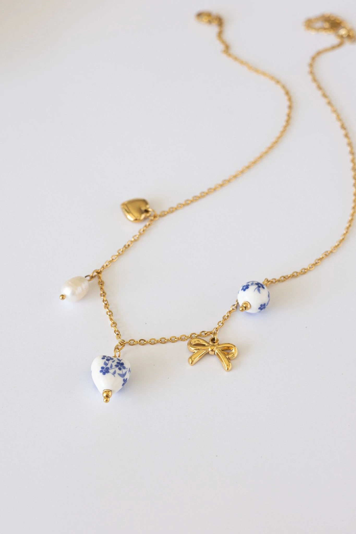 Bella Charm Necklace in Blue by Rose & Clay