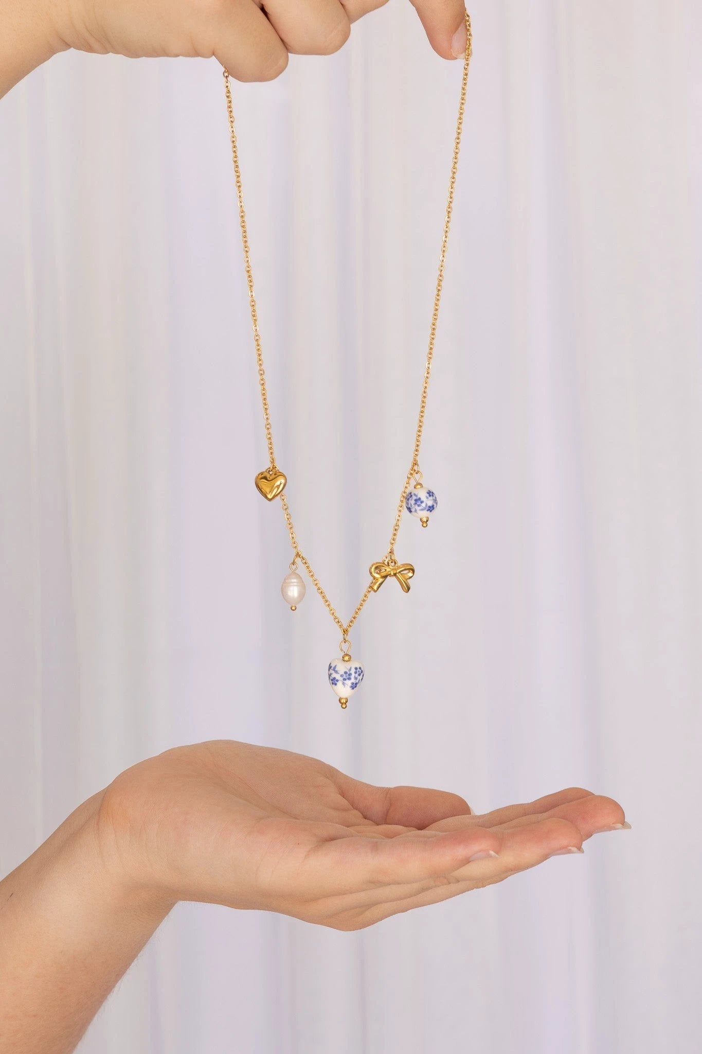 Bella Charm Necklace in Blue by Rose & Clay