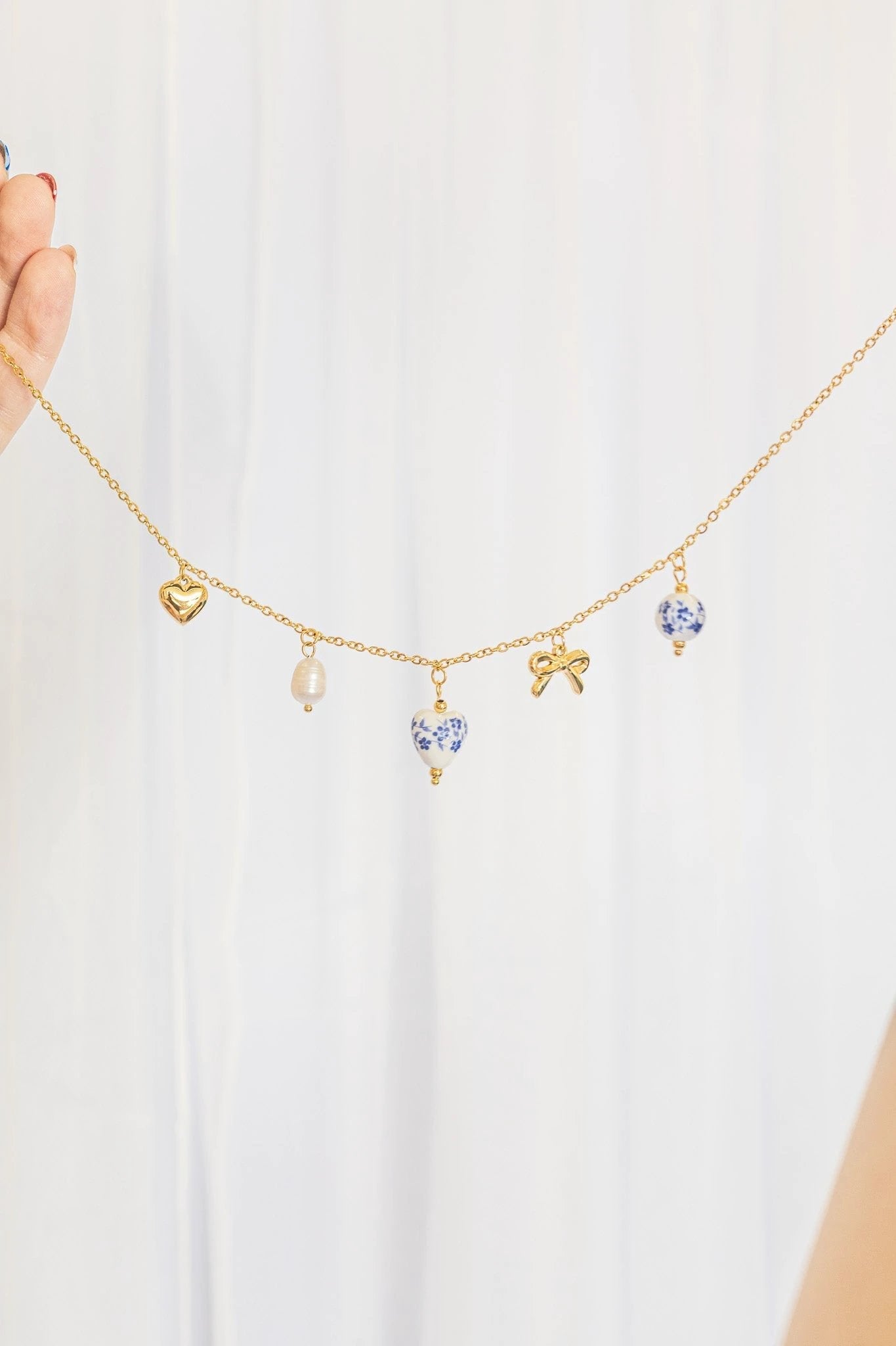Bella Charm Necklace in Blue by Rose & Clay